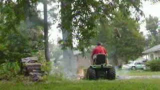 Deere 316 Kohler pushing burn pile