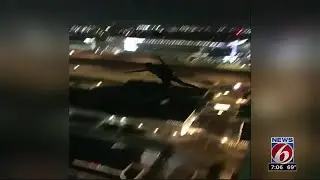 Man parachutes off 55 West