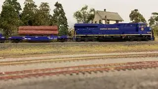 Norfolk Southern heritage unit (N & W) small log train