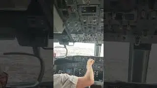 Qantas 737 jump seat cockpit view landing Sydney airport stormy weather.