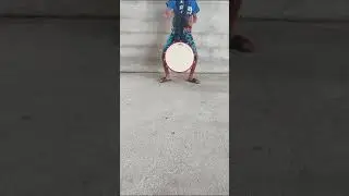 Sanjeev preforming the tikora hand on a tassa drum