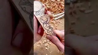 carving detailed animal and plant figures on a wood piece using small knives for creative woodcraft