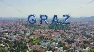 Inscription on video. Graz, Austria. The historic city center aerial view. Mount Schlossberg (Castle