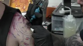 Chris Clancy getting interviewed during a tattoo session (HD)