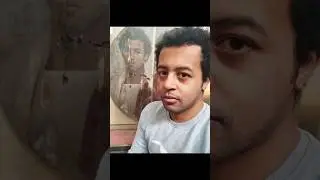 An Egyptian man takes a selfie with a portrait of an Egyptian man from the Roman era 2,000 years ago