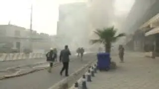 Iraq - Immediate aftermath of bombing outside US consulate / Wave of bombings hit Baghdad, killing 2