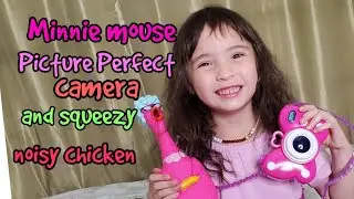 Minnie Mouse Disney Junior Picture Perfect Camera and a sqeezy noisy chicken. Toy shopping