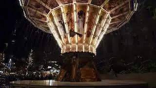 Illuminated Christmas Market Carousel at Night