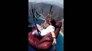 That sure looks safe he is on a flying sofa