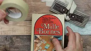 (Sold) Fun vintage altered game box into a Junk Journal