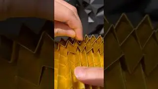 Folding Gold paper into geometric forms. Origami; Seed(Gold)