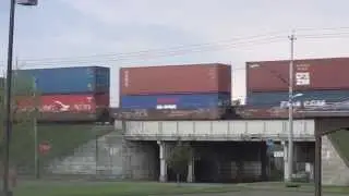 CSX Q022 Train Roars by on Elevated Tracks