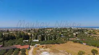Didim, Turkey. Aerial drone flight over rural fields and houses towards Aegean Sea and Temple of ...