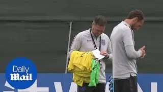 Steve Holland seen holding training notes suggest line-up