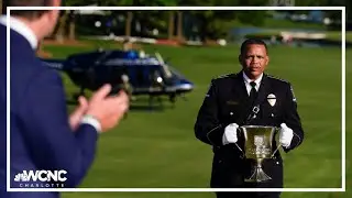 Charlotte-Mecklenburg police chief delivers Wells Fargo Championship trophy to Rory McIlroy
