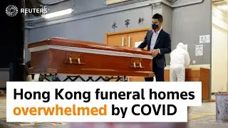 Hong Kong funeral parlors overwhelmed by COVID