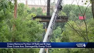 Cranes remove part of railroad bridge hit by dump truck in Pittsburgh