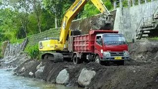 Komatsu PC210 Excavator Crane Truck and Ready Mix Working on River Groundsill Construction