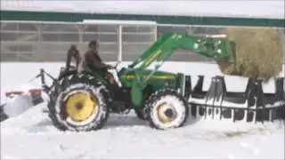 The Ultimate Horse Hayfeeder - Putting out a Round Hay Bale by Tractor