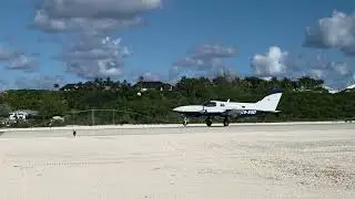 111925 C6-SGD Cessna 402C landing on R34 Staniel Cay, Bahamas, MYES
