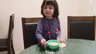 A toddler can make a sensory bin for a baby.