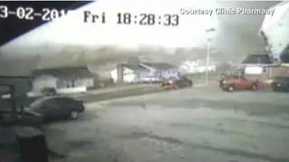 Tornado's destruction caught on security cam