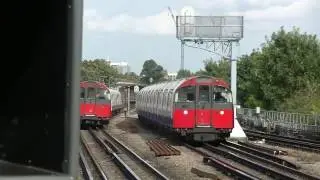 London Underground 1973 Stock 877 and 208 passing Tunrham Green