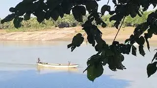 a small sandy boat is moving..tiny river mini boat