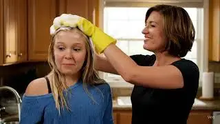Mother shampoos daughters Hair again.