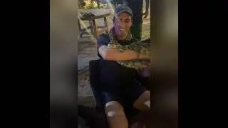 Pat Cummins playing with a python in Sri Lanka