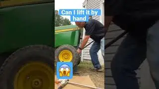 Lifting a John Deere 400 by hand with steel bar
