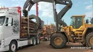 Unloading timber truck with high-lift.