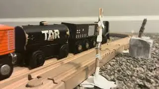 NS local passes a railroad crossing 