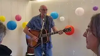 At Ged Murray's celebration, Ged's brother-in-law Dave Greatbanks takes to the stage.