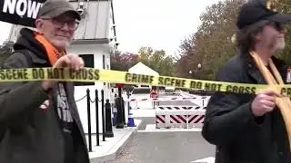 Protesters wrap 'crime scene' tape around White House perimeter | REUTERS