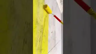 Painting crisp yellow line on concrete surface