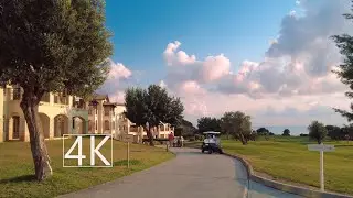 Walking in an idyllic green village of Aphrodite Hills, Cyprus.