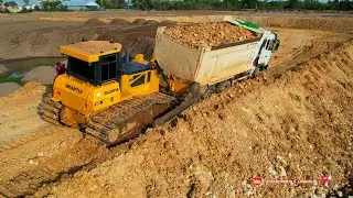Extreme dump truck rescues stuck up - Recovery techniques for stuck vehicles by heavy Bulldozer