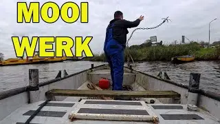 Twee ankers zoeken met een roeiboot en een dreg.