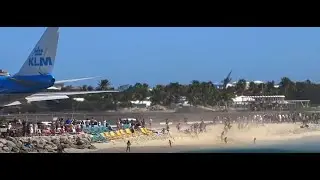Plane takes off blowing people on the beach into the water! INSANE