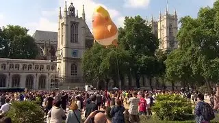Protesters use giant inflatable baby to protest Trump's visit to London