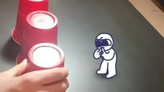 Guess what's behind the cup (he lost)