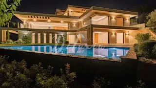 Sublime villa d'architecte avec piscine à débordement et vue mer sur le Golfe de Saint-Tropez.