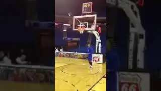Nba player DJ Stephens kissing the rim