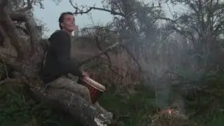 Lee playing Djembe at the fallen tree