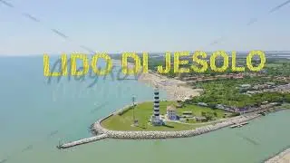 Inscription on video. Italy, Jesolo. Light House Faro di Piave Vecchia. Lido di Jesolo, is the beach
