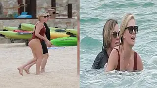 Charlize Theron frolics in the ocean on Mexican getaway