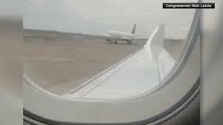 2 planes bump wings while on the runway at Reagan National Airport