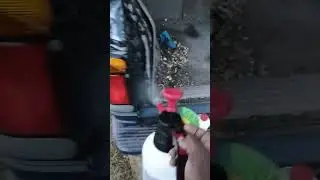 pump sprayer the tailgate cleaning area of a Ford explorer