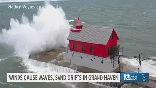 Surfers and campers ride out high waves and drifting sands in Grand Haven